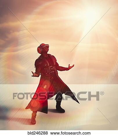 Stock Photo - Man wearing long coat using virtual reality helmet. Fotosearch