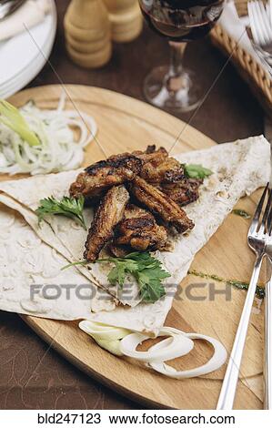 Stock Image - Meat and bread on tray. Fotosearch