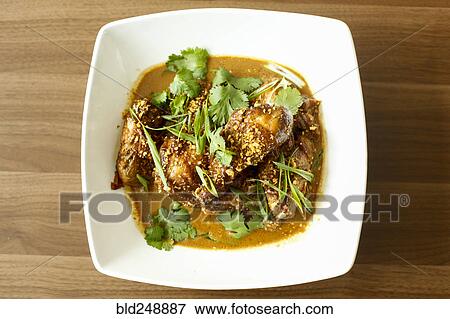 Meat and leaves in bowl View Large Photo Image Stock Photo - Meat and leaves in bowl. Fotosearch