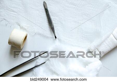 "Medical gauze, tweezers, cotton and tape" View Large Photo Image Picture - "Medical gauze, tweezers, cotton and tape". Fotosearch