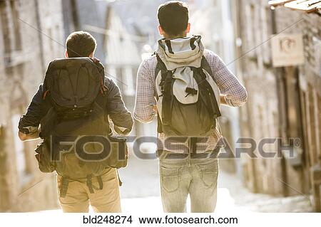 Men backpacking in city View Large Photo Image Picture - Men backpacking in city. Fotosearch