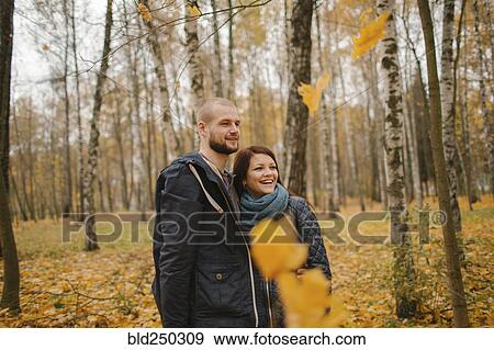 Middle Eastern couple standing in park in autumn View Large Photo Image Stock Photo - Middle Eastern couple standing in park in autumn. Fotosearch