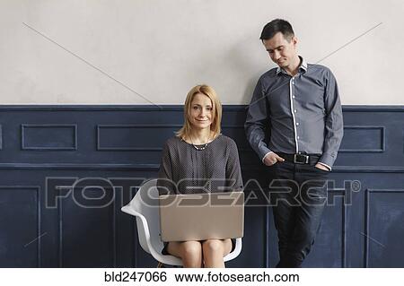 Middle Eastern couple using laptop View Large Photo Image Stock Photograph - Middle Eastern couple using laptop. Fotosearch