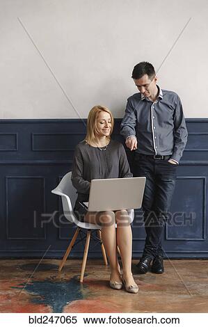 Stock Photography - Middle Eastern couple using laptop. Fotosearch