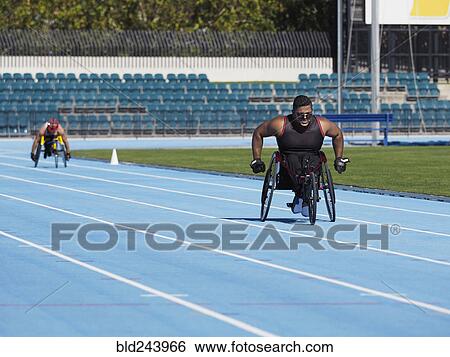 Middle Eastern man racing in wheelchair on track View Large Photo Image Stock Photograph - Middle Eastern man racing in wheelchair on track. Fotosearch