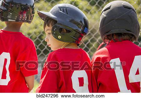 Stock Photograph - Mixed Race boy playing baseball. Fotosearch