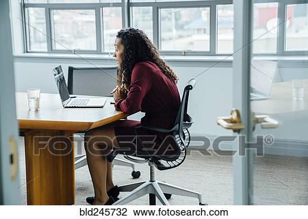 Mixed race businesswoman on video conference View Large Photo Image Stock Image - Mixed race businesswoman on video conference. Fotosearch