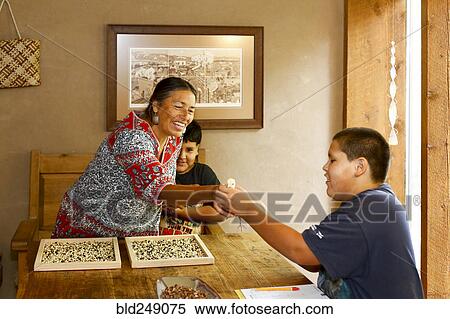 Mother and sons admiring baby turkey at table View Large Photo Image Stock Photography - Mother and sons admiring baby turkey at table. Fotosearch