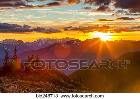 Stock Image - Mountain landscape at sunset. Fotosearch