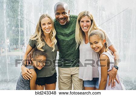 Multi-ethnic family posing near fountain View Large Photo Image Stock Photo - Multi-ethnic family posing near fountain. Fotosearch