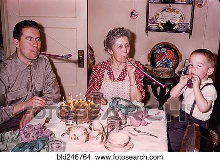 Picture - Multi-generation family celebrating birthday. Fotosearch
