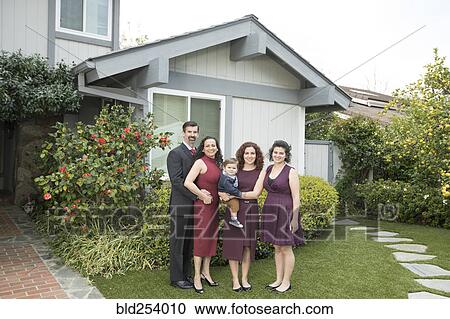 Multi-generation family posing near house View Large Photo Image Stock Image - Multi-generation family posing near house. Fotosearch