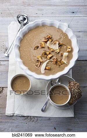 Mushroom soup on wooden table View Large Photo Image Stock Photo - Mushroom soup on wooden table. Fotosearch