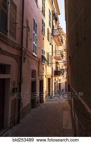 Stock Photo - Narrow street between buildings, Manarola, Liguria, Italy. Fotosearch