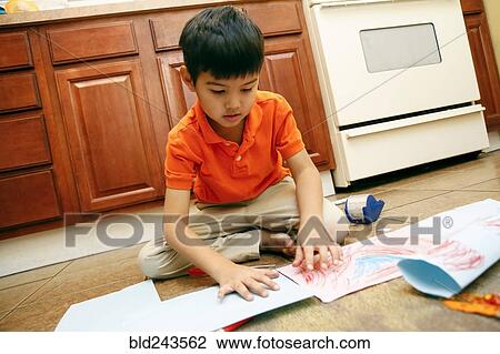Native American sitting on kitchen floor making artwork View Large Photo Image Stock Image - Native American sitting on kitchen floor making artwork. Fotosearch