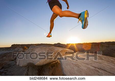 Native American woman running and jumping in desert View Large Photo Image Picture - Native American woman running and jumping in desert. Fotosearch