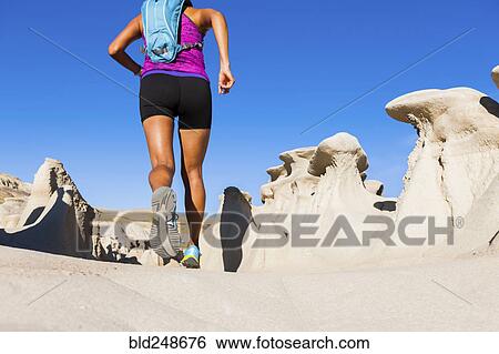Native American woman running in desert View Large Photo Image Stock Photograph - Native American woman running in desert. Fotosearch