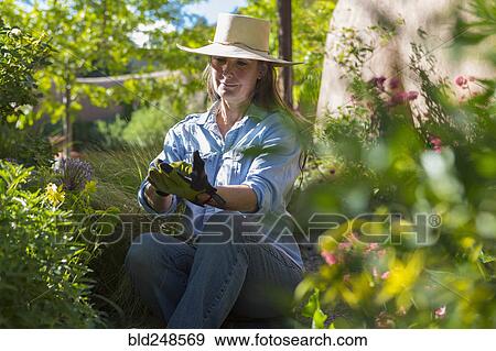 Stock Photo - Older Caucasian woman gardening. Fotosearch