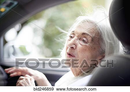 Older Caucasian woman sitting in car View Large Photo Image Stock Photo - Older Caucasian woman sitting in car. Fotosearch