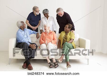 Older people laughing on sofa View Large Photo Image Picture - Older people laughing on sofa. Fotosearch