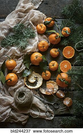 Stock Photo - Oranges on wooden table. Fotosearch