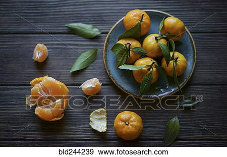 Stock Photo - Oranges on wooden table. Fotosearch