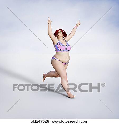 Stock Photo - Overweight woman running in bikini. Fotosearch