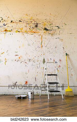 Paint splattered on wall near ladder and broom View Large Photo Image Stock Image - Paint splattered on wall near ladder and broom. Fotosearch
