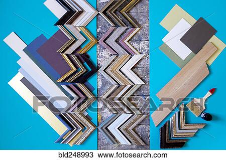 Stock Image - Paintbrush and picture frame parts. Fotosearch