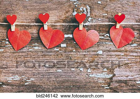 Paper hearts hanging on string with clothespin View Large Photo Image Stock Image - Paper hearts hanging on string with clothespin. Fotosearch