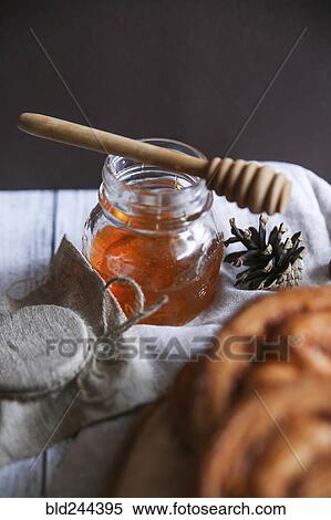 Stock Photography - Pastry buns with honey. Fotosearch