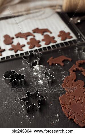 Picture - Pastry cutters and gingerbread dough. Fotosearch