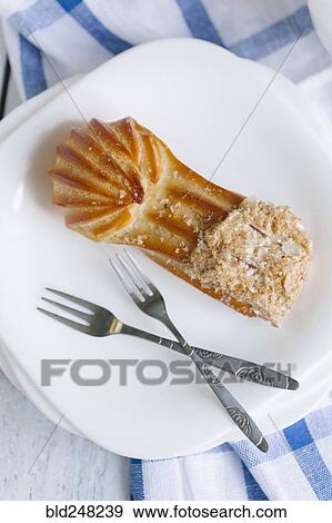Pastry on plate with forks View Large Photo Image Stock Photo - Pastry on plate with forks. Fotosearch