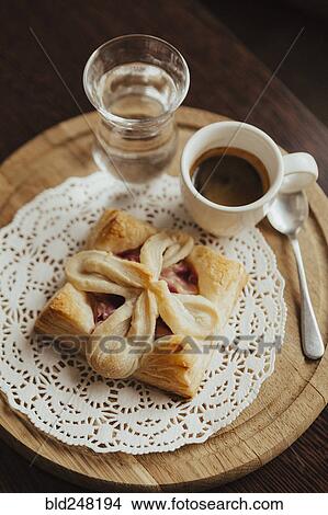 Pastry on the doily with espresso View Large Photo Image Picture - Pastry on the doily with espresso. Fotosearch