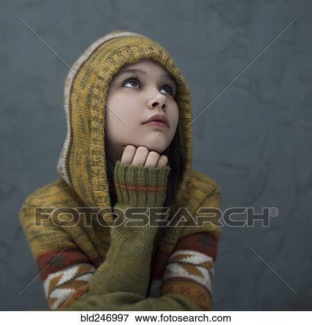 Pensive Caucasian girl wearing hood View Large Photo Image Stock Photo - Pensive Caucasian girl wearing hood. Fotosearch