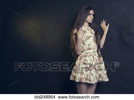 Pensive Caucasian teenage girl leaning on wall View Large Photo Image Picture - Pensive Caucasian teenage girl leaning on wall. Fotosearch