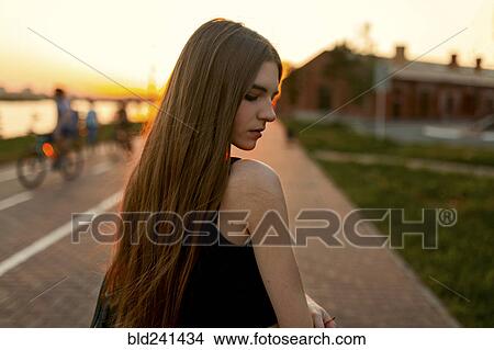 Pensive Caucasian woman at waterfront View Large Photo Image Picture - Pensive Caucasian woman at waterfront. Fotosearch