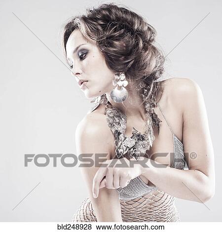Pensive Caucasian woman wearing sheer dress looking away View Large Photo Image Stock Photo - Pensive Caucasian woman wearing sheer dress looking away. Fotosearch