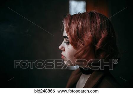 Pensive Caucasian woman with red hair View Large Photo Image Stock Photography - Pensive Caucasian woman with red hair. Fotosearch