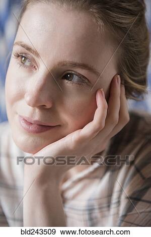 Pensive woman with hand on chin View Large Photo Image Stock Photo - Pensive woman with hand on chin. Fotosearch
