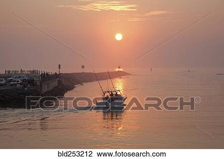 People on boat and at waterfront at sunset View Large Photo Image Stock Image - People on boat and at waterfront at sunset. Fotosearch