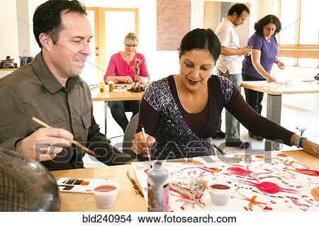 Picture - People painting in art class. Fotosearch