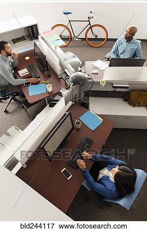 Stock Photo - People working at computers in office. Fotosearch