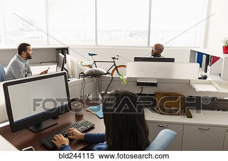 Stock Photography - People working at computers in office. Fotosearch