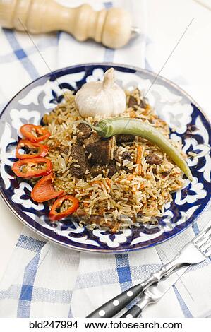 Picture - Pepper and onion on plate with beef and rice. Fotosearch