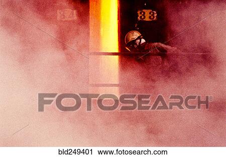 Stock Image - Person wearing mask in smoke. Fotosearch