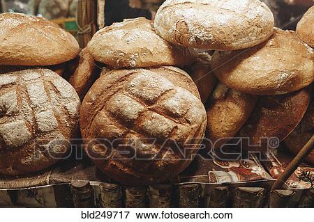 Stock Photo - Pile of loaves of bread on table. Fotosearch
