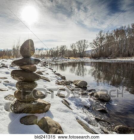 Pile of rocks balancing near river View Large Photo Image Stock Photography - Pile of rocks balancing near river. Fotosearch