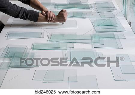 Piles of glass and glass cutter on white table View Large Photo Image Stock Photography - Piles of glass and glass cutter on white table. Fotosearch