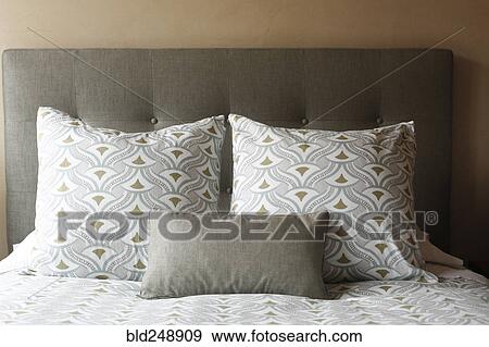 Pillows on the bed near headboard View Large Photo Image Stock Photo - Pillows on the bed near headboard. Fotosearch
